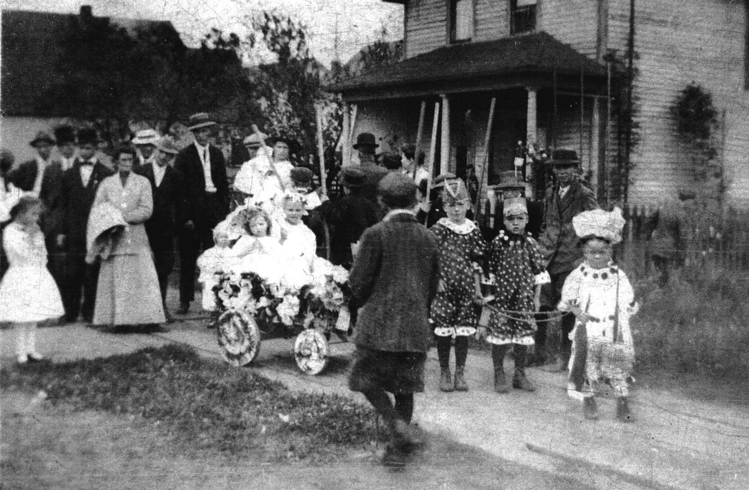 This Fourth of July parade took place in about 1911 in Pe Ell. The Allen children took first place with their float on that day. In the lead is Bob Allen, who is thought to be about 4 years old at the time. Behind him are his brothers John and Rex. All three boys are hitched to the wagon pulling Catherine (on the left) and an unknown neighbor child (on the right). The children’s parents were Harvey and Mabel Allen of Pe Ell. Harvey was a barber and fiddle player and Bob was the father of this photo’s contributor.